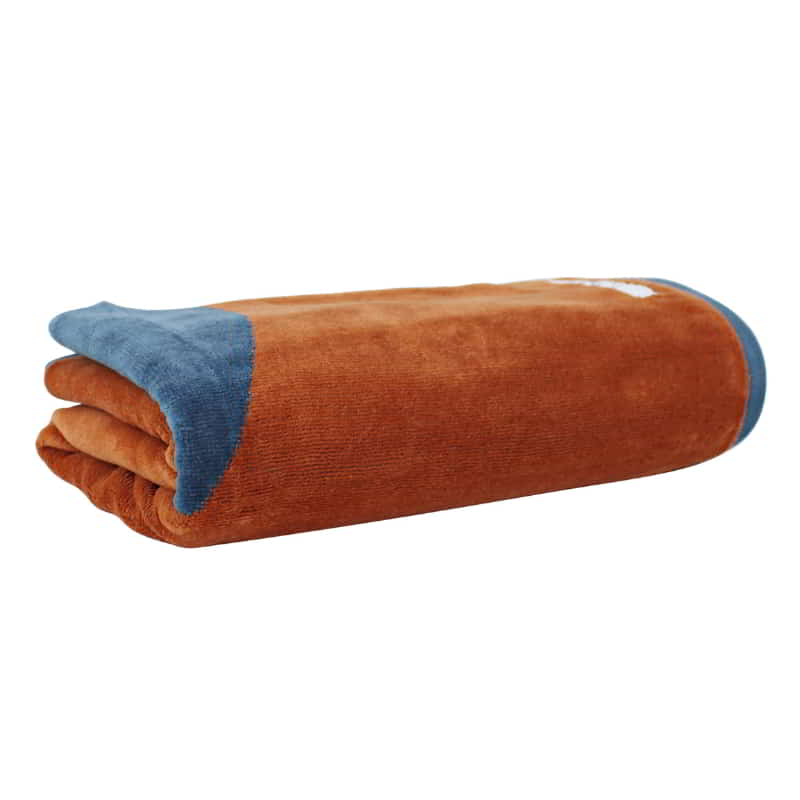 alt="A neatly rolled blue dusk bath towel featuring its cottony texture and premium quality cotton"