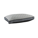 alt="View from a reclined angle of a memory foam pillow features a cosy velvet cover"