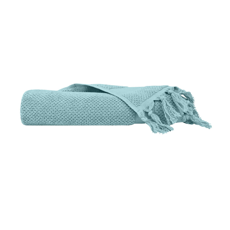alt="An elegantly folded blue hand towel, showcasing its minimal and soft details"