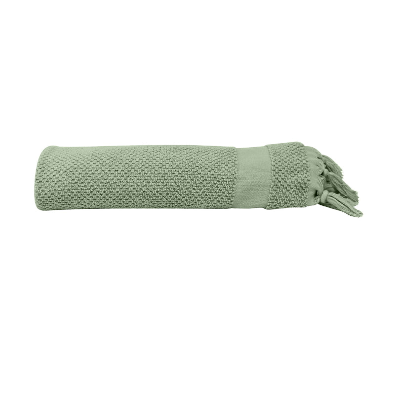 alt="An elegantly folded green hand towel, showcasing its minimal details"