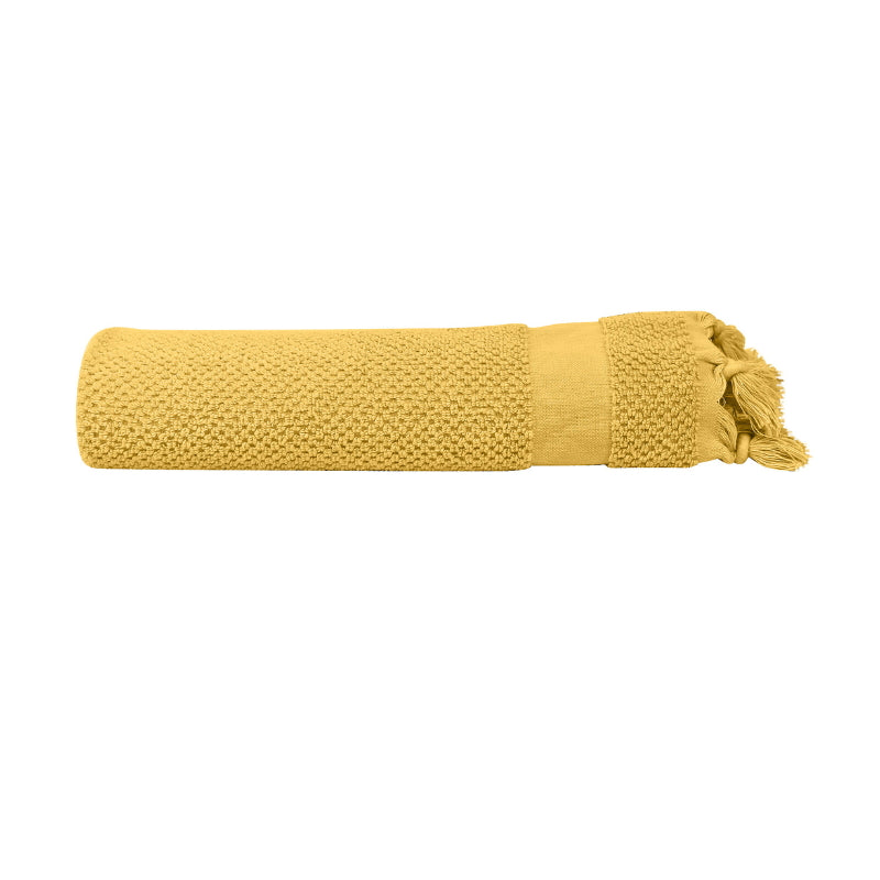 alt="An elegantly folded yellow hand towel, showcasing its minimal details"