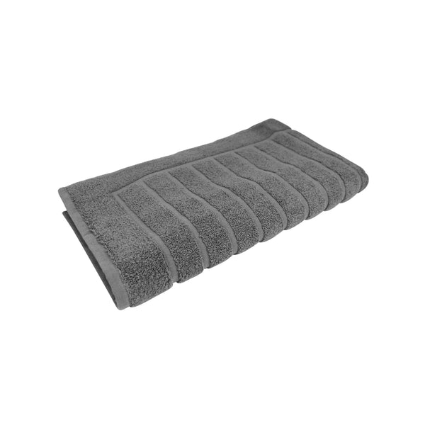 alt="The Cloud Valencia Zero Twist bath mat unveils intricate folded details, adding a luxurious touch to your bathroom"