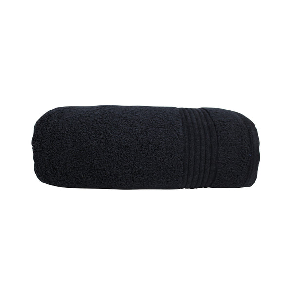 alt="A neatly rolled black valencia zero twist towel featuring its soft and intricate details."