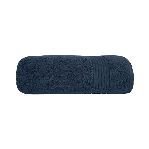 alt="A neatly rolled nautical navy valencia zero twist towel featuring its soft and intricate details."