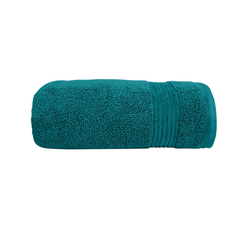 alt="Zoom in details of teal Bath towel featuring its premium-quality cotton and high level of softness."