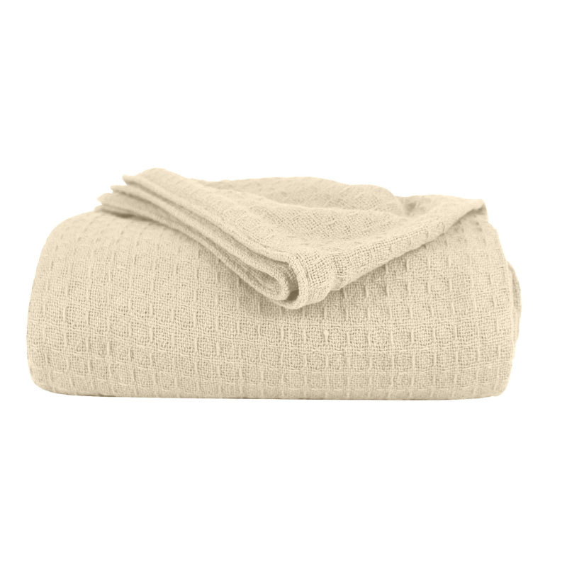 alt="A natural  Cotton Blanket featuring its luxuriously soft and resilient Cotton with added polyester."
