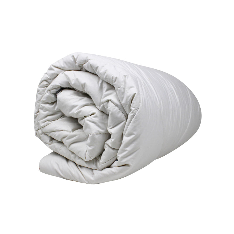 alt="Side view of the rolled quilt crafted washable wool for decadently cosy warmth"