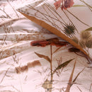Close-up of the Cely Multi Quilt Cover showing detailed flower illustrations and cotton texture