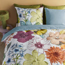 Top view of Lotti Quilt Cover with vibrant hand-drawn flowers in pink, yellow, blue and green