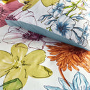 Close-up view of Lotti Quilt Cover with vibrant hand-drawn flowers in pink, yellow, blue and green