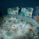 Overhead view of the Lou Blue Green Quilt Cover Set styled on a bed with matching pillows