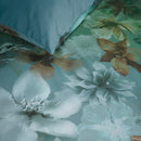 Close-up of floral pattern on the Bedding House Lou Blue Green Quilt Cover Set showing soft greens, browns and whites