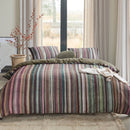 Roman Multi Quilt Cover styled on a bed with wide windows and neutral curtains