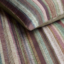 Close-up of cotton satin texture with earthy watercolour stripe detailing