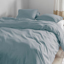 Bed dressed in Summer quilt cover set with soft folds and light wrinkles for a relaxed look