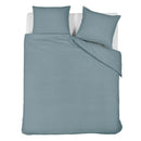 Bedding House Summer quilt cover set styled on bed in soft blue grey with seersucker texture