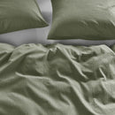 Quilt cover draped on bed showing its lightweight, airy design