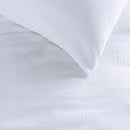 Close-up of lightweight seersucker fabric texture in fresh white