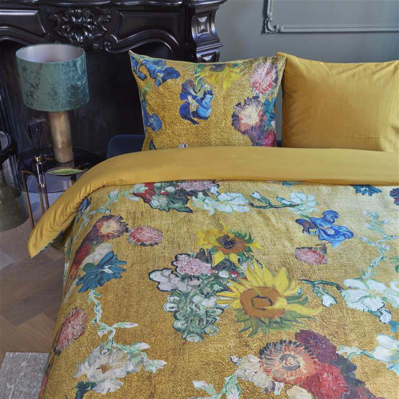 alt="Close-up look of a quilt cover set inspired by Van Gogh Museum's 50th-anniversary bouquet, featuring a vibrant floral pattern on a golden background."