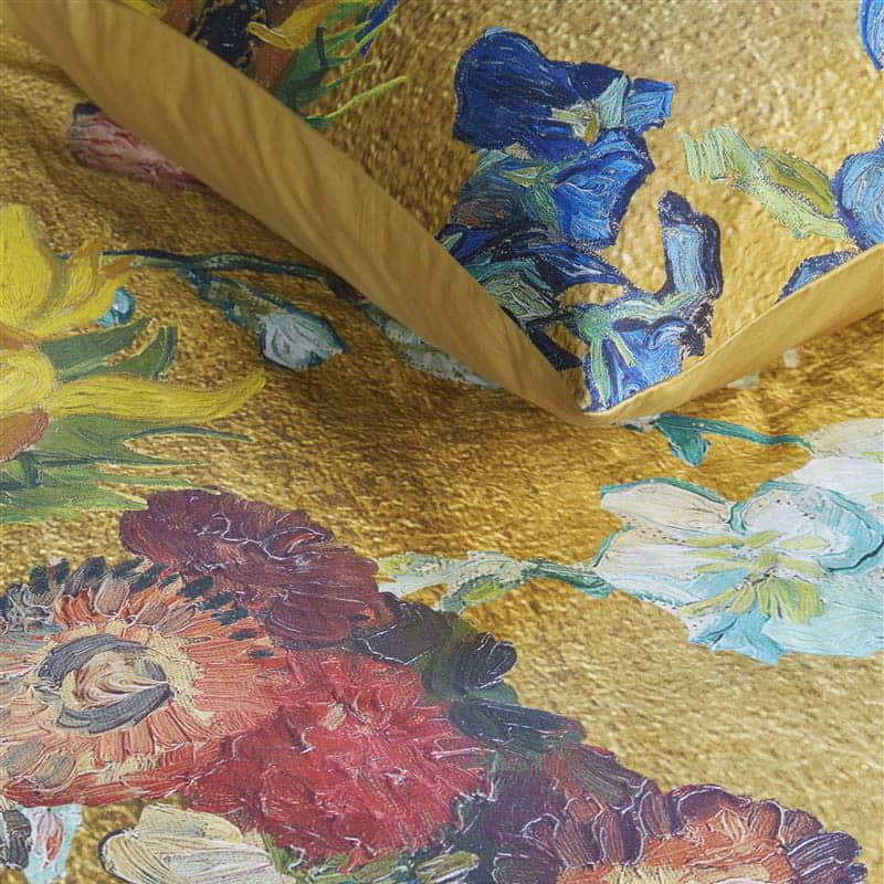 alt="Close-up look of a quilt cover set inspired by Van Gogh Museum's 50th-anniversary bouquet, featuring a vibrant floral pattern on a golden background."
