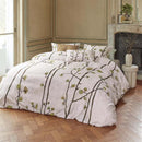 alt="Van Gogh Museum-inspired quilt cover with 'Flowering Plum Orchard' pattern in a luxurious bedroom"