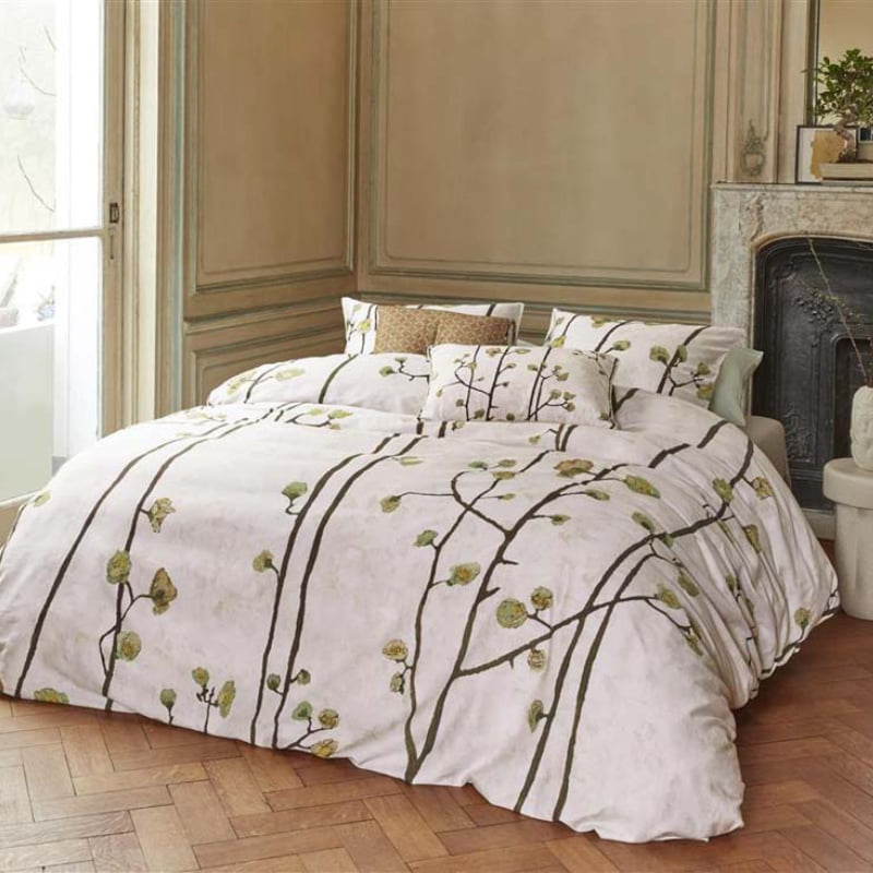 alt="Side view of a Van Gogh Museum-inspired quilt cover with 'Flowering Plum Orchard' pattern in a luxurious bedroom"