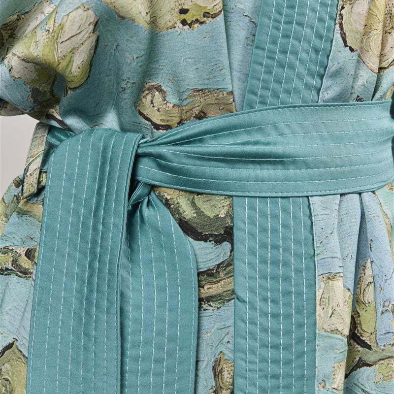 alt="Close-up details of Van Gogh-inspired Almond Blossoms kimono with turquoise-blue background"