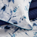 A serene nina ink print on a quilt cover set, embodying luxury and comfort with its exquisite cotton fabric.