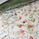 Close up details of the elegant stems jade quilt cover set with watercolour florals, enhancing the tranquil atmosphere of the bedroom.