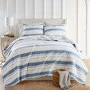 Classic Quilts Coastal Stripe Sea Coral Coverlet Set with reversible design styled on a bed.