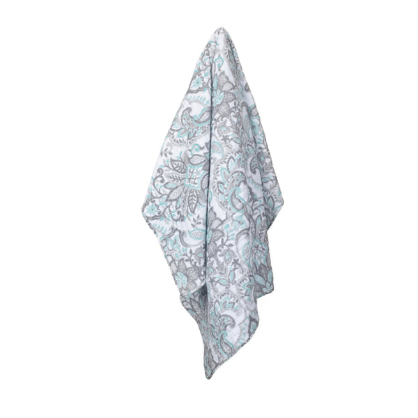 alt="A beautiful cotton throw designed with a leaf pattern"
