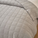 Classic Quilts coverlet in smokey grey adding calm and comfort to a bedroom.