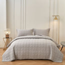 Classic Quilts coverlet in smokey grey adding calm and comfort to a bedroom.