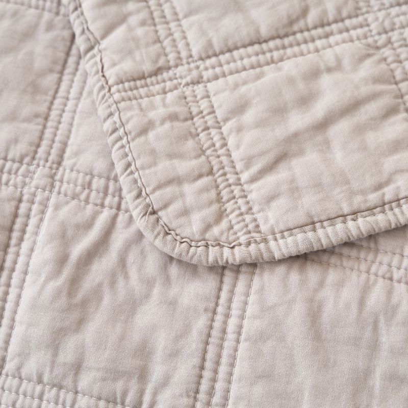 Classic Quilts Square Sand Coverlet styled neatly on a bed with matching pillowcases.