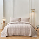 Classic Quilts Square Sand Coverlet styled neatly on a bed with matching pillowcases.