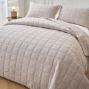 Classic Quilts Square Sand Coverlet styled neatly on a bed with matching pillowcases.