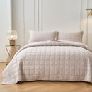 Classic Quilts Square Sand Coverlet styled neatly on a bed with matching pillowcases.