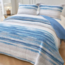 Classic Quilts Windsor Ocean Coverlet styled on a bed with matching pillowcases.
