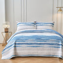 Classic Quilts Windsor Ocean Coverlet styled on a bed with matching pillowcases.