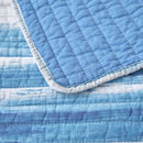Classic Quilts Windsor Ocean Coverlet styled on a bed with matching pillowcases.