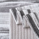 Classic Quilts Windsor Stormy Coverlet styled on a bed with matching pillowcases.