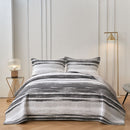 Classic Quilts Windsor Stormy Coverlet styled on a bed with matching pillowcases.