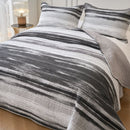 Classic Quilts Windsor Stormy Coverlet styled on a bed with matching pillowcases.