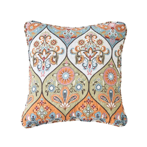 A cosy cushion with a symmetrical, ornate pattern featuring floral motifs in modern colours, and made of 100% cotton.