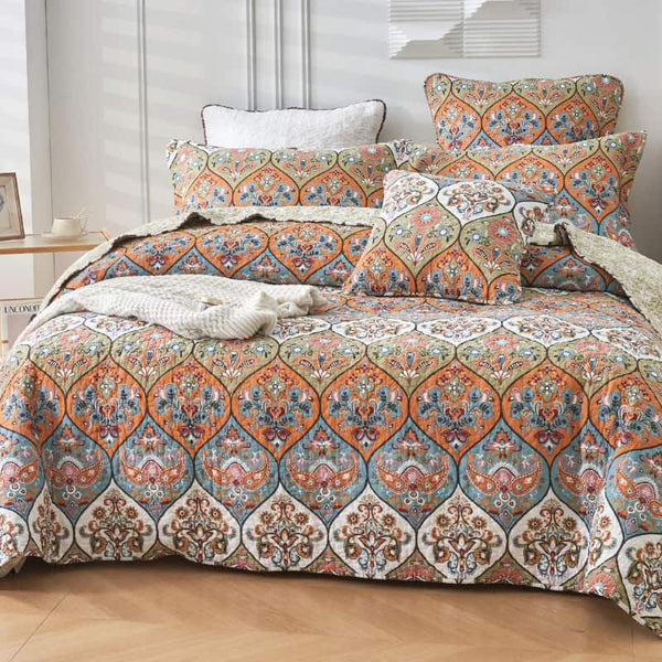100% cotton coverlet featuring a symmetrical design, with floral motifs in modern colours, fully machine washable.