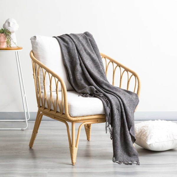 alt="Luxurious grey throw blend of acrylic and wool, featuring a vibrant design and stylish tassel accents"