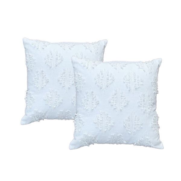 Luxurious white feather-filled cushions adorned with intricate embroidered designs, showcasing a sculptural wave of tufting on a soft cotton base.