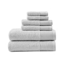 A stack of luxurious grey towels made from eco-friendly Tencel and cotton, promoting sustainability and advanced hygiene.