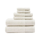 A stack of luxurious ivory towels made from eco-friendly Tencel and cotton, promoting sustainability and advanced hygiene.