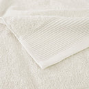 Zoom in details of a luxurious ivory towels made from eco-friendly Tencel and cotton, promoting sustainability and advanced hygiene.